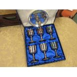 A cased set of six silver plate goblets and a plated dish