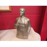 A cast metal bust of Lenin indistinctly signed, dated 1977,