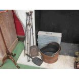 A copper coal bucket and fireside tools with Tippy ashpan