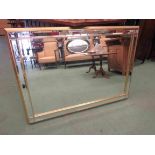 An ornate bevelled edge mirror,