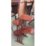 A folding four tier inlaid cake stand