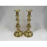 A pair of brass candlesticks,