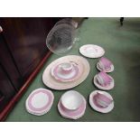 A pink and white ground part dinner service and various serving dishes