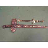 A decorative Malaysian Kris knife with carved gilt wood scabbard and a repro Spanish dagger