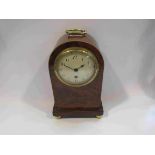 A 19th Century mahogany and satin inlaid mantel timepiece of arched form,