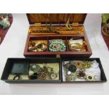 A jewellery box with contents and a selection of costume jewellery