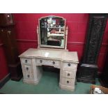 A limed oak dressing table with Gothic styling,