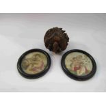 An Oriental carved wooden dragon paperweight and two small framed prints of cherubs