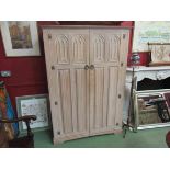 A limed oak double wardrobe with Gothic detail,