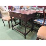 An 18th Century style oak side table the single frieze drawer over turned legs joined by stretchers,