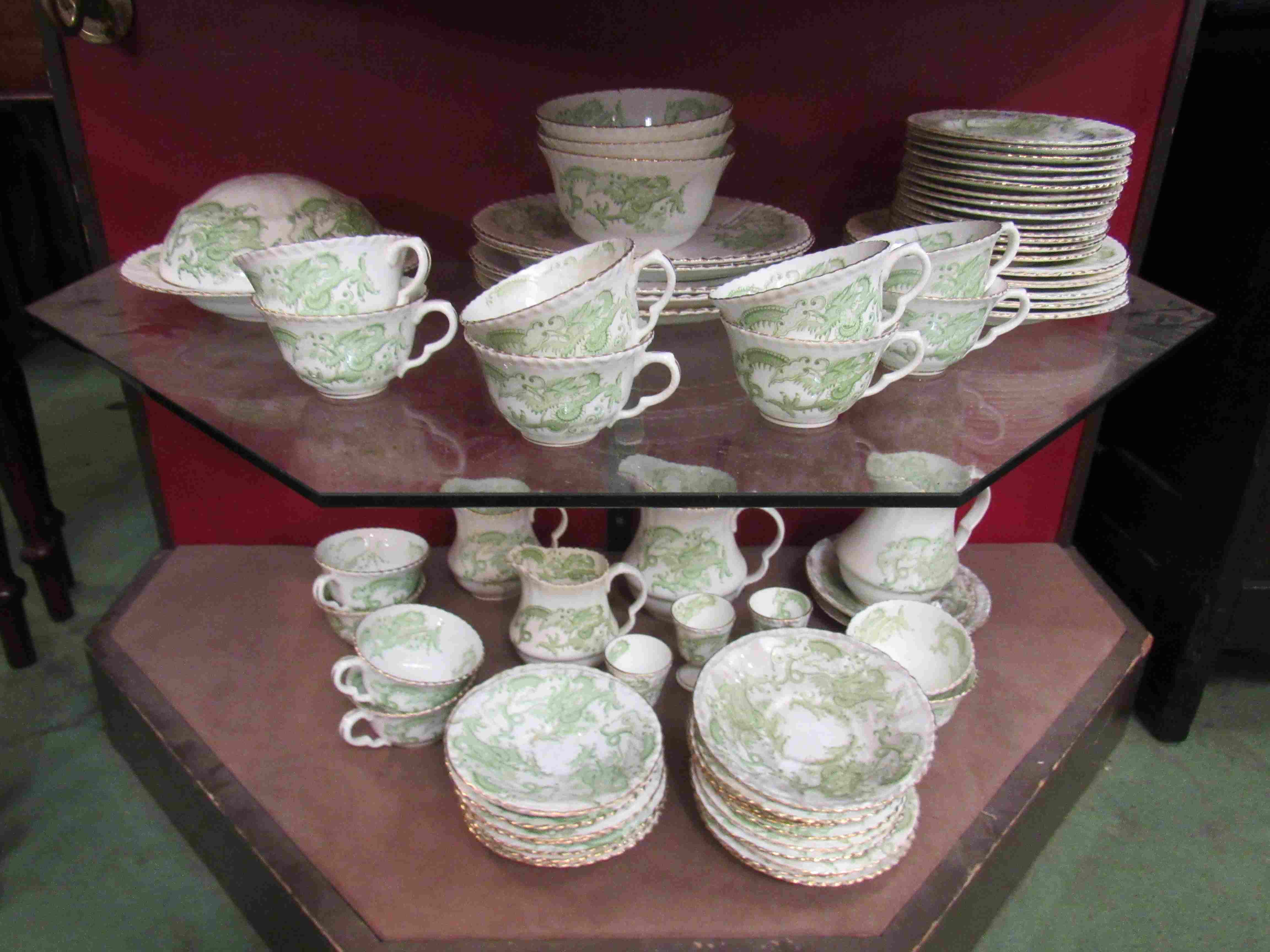 Staffordshire green and white dragon design tablewares including bowls, plates, egg cups etc,