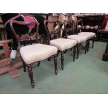 A set of four William IV mahogany kidney shape back chairs on turned and tapering legs