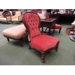 A Victorian walnut buttoned spoon back armchair over a serpentine front seat on turned legs and