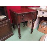 An early Victorian mahogany two drawer work table the rising leaves over turned and tapering legs