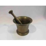 A bronze pestle and mortar