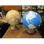 Two world globes on stands