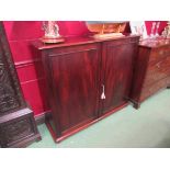 A George III flame mahogany two door estate cupboard with key the fitted five drawer interior and