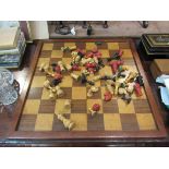 An early 20th Century treen chess board and pieces