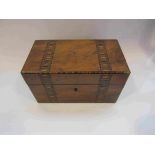 An inlaid tea caddy with lidded interior