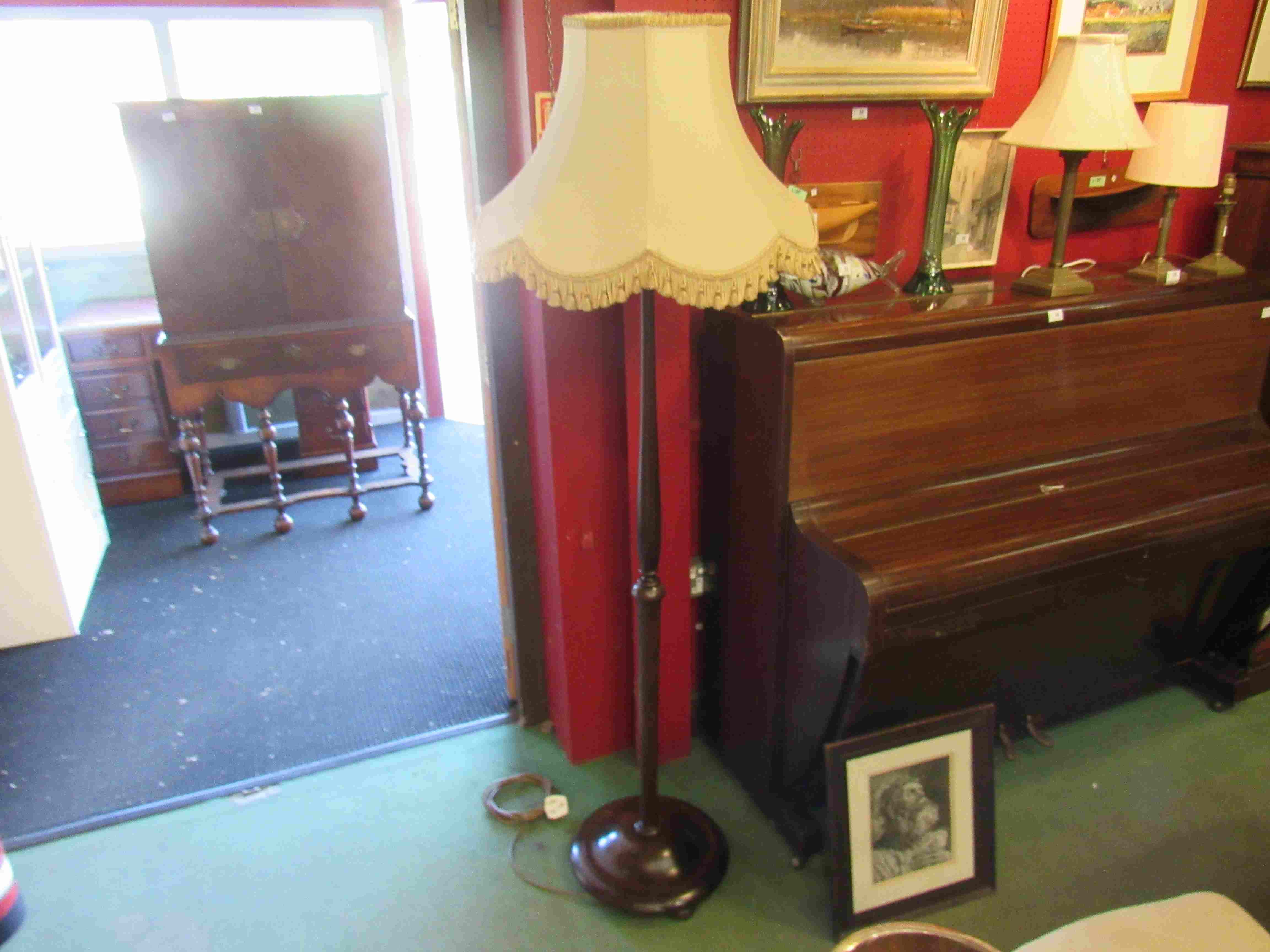 An early 20th Century mahogany standard lamp with shade