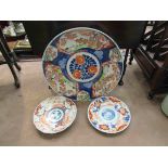 A Japanese imari charger and two smaller dishes (3)