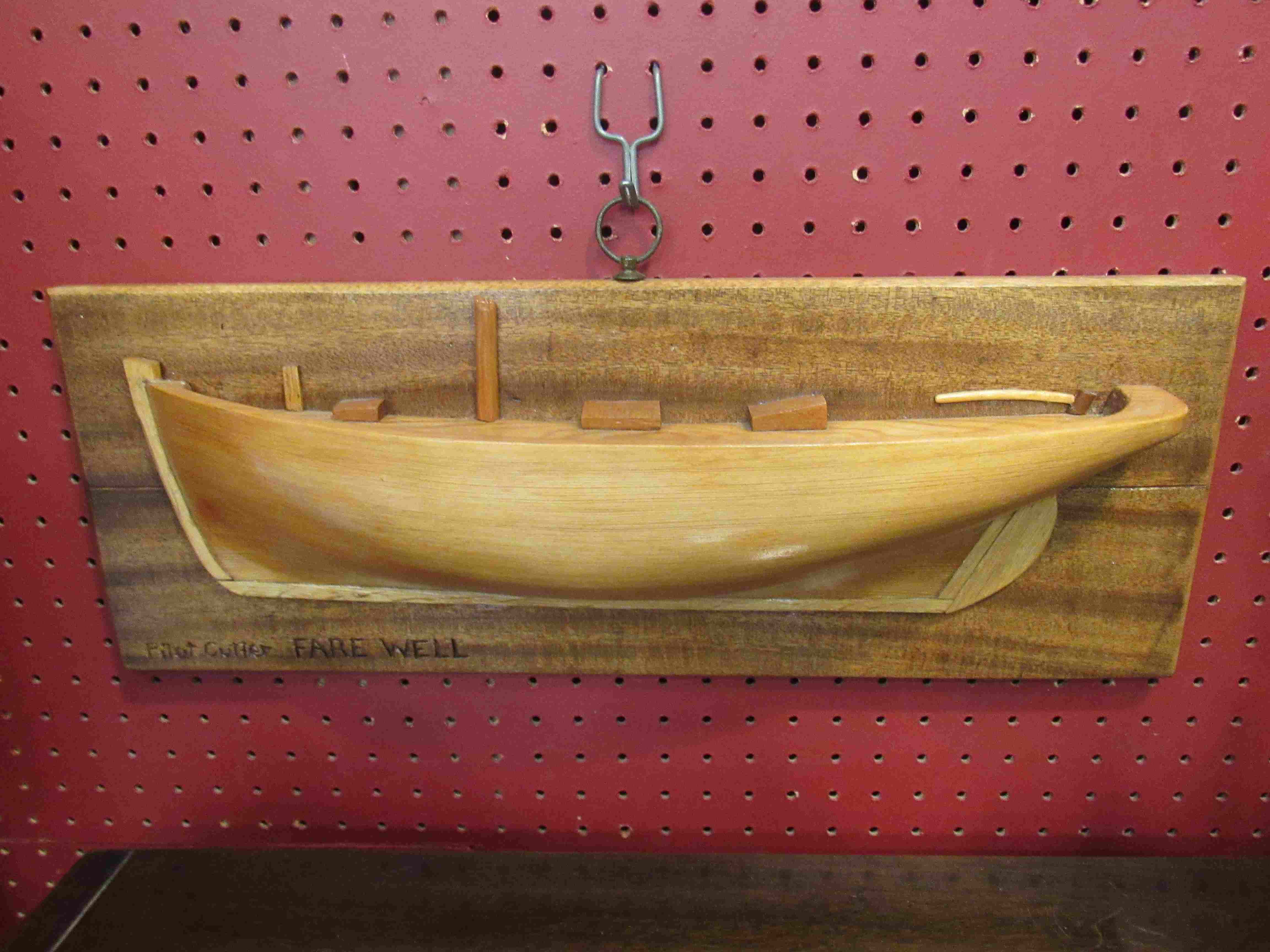 A near pair of wooden boat wall plaques