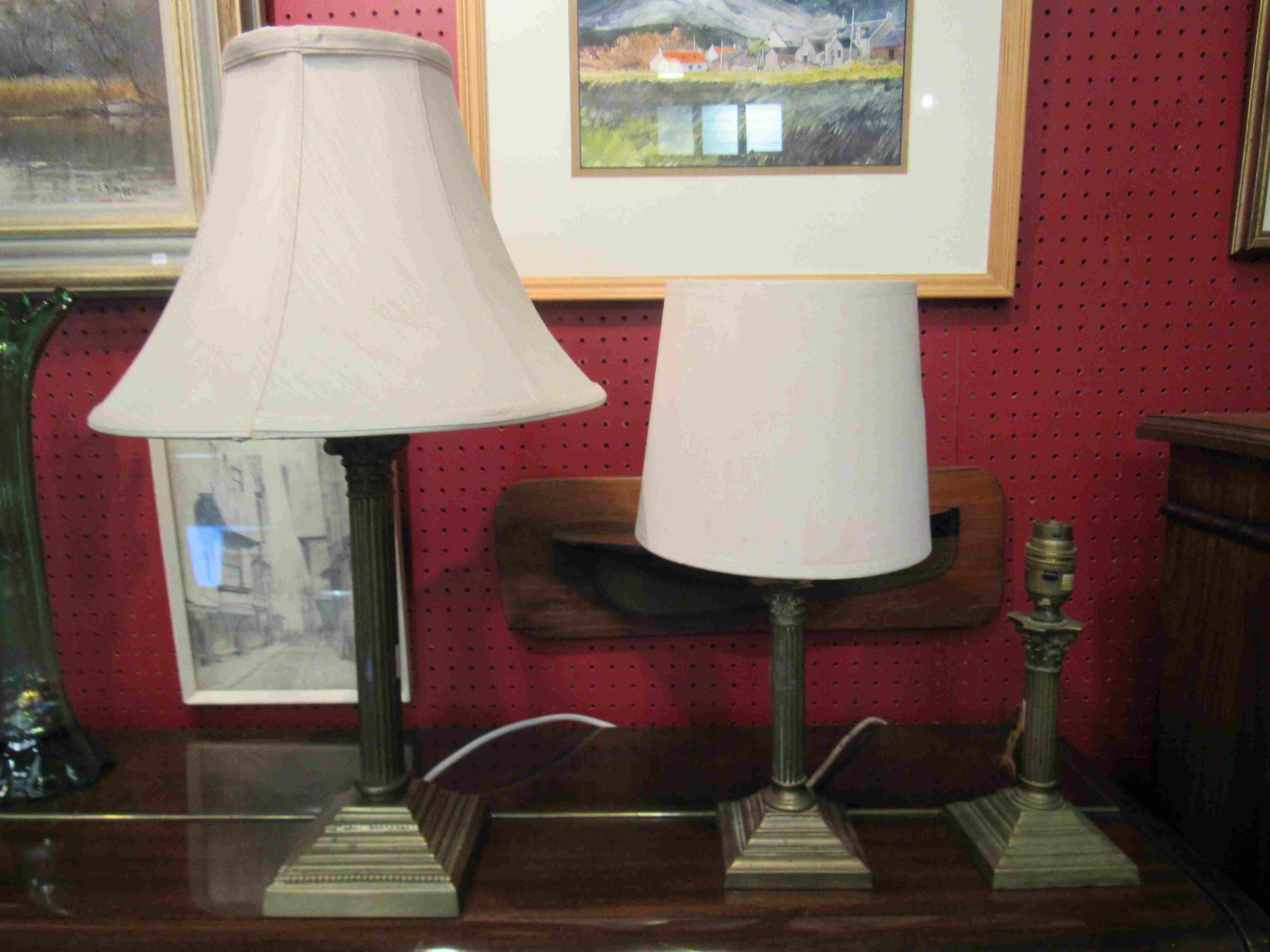 A brass column form lamp base and two others (3)