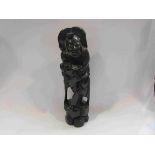 A carved Oriental hardwood figure,