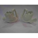 A matching pair of porcelain swans with registered mark,