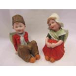 Gebruder Heubach bisque Dutch style pair of seated child figurines with flower baskets,