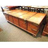 An Eastern hardwood large coffee table trunk with twin handles,