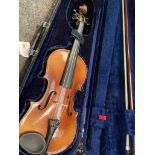 An early 20th Century violin, cased with bow,
