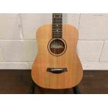 A Taylor "Baby Taylor" BT1 mini acoustic guitar with soft case