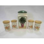 Four herb pots and a storage jar