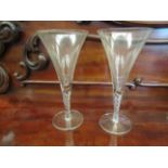 A pair of twisted stem trumpet form drinking glasses