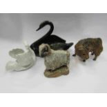A pottery ram and bull and two ceramic swan figures