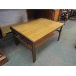 A 1970's teak two tier coffee table