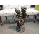 After Moreau: 20th Century bronze reproduction figural group depicting two cherubs on circular