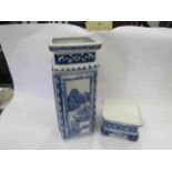 An Asian design blue and white square vase on stand,