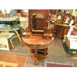 A bow front dressing table on turned front leg with two drawers,