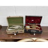 A silver plated Dynasty cornet and a brass cornet (unbranded),