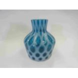 A mottled milky blue glass vase,