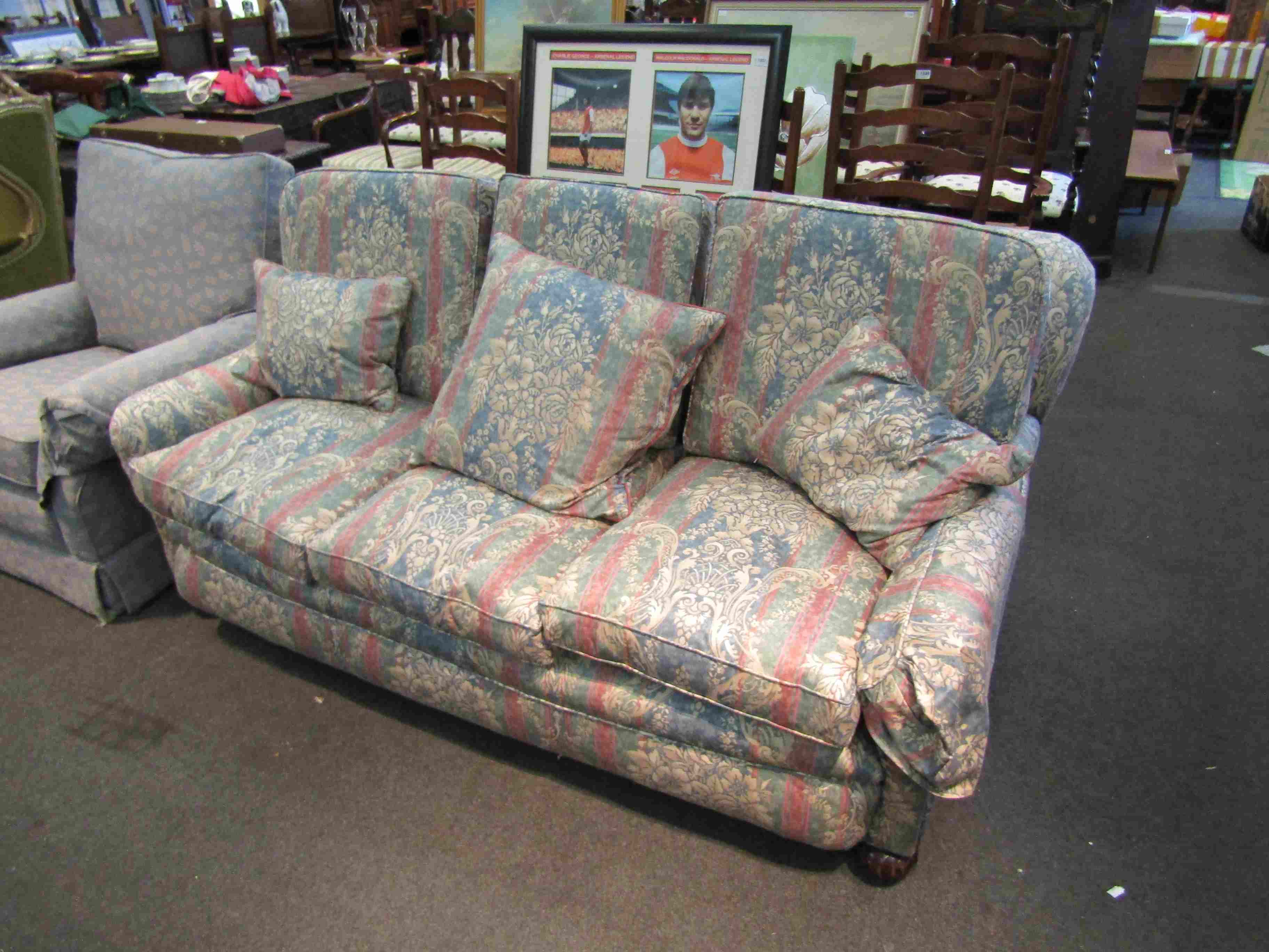 An early 20th Century sofa with feather filled cushions,