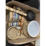 A box of percussion instruments and a brass post horn