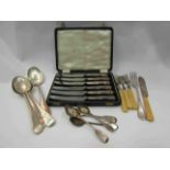 A cased set of six silver knives marked Sheffield,