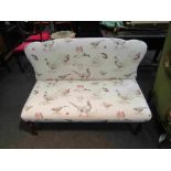 A Victorian mahogany open arm end of the bed seat with game bird upholstery,