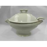 A soup tureen and ladel