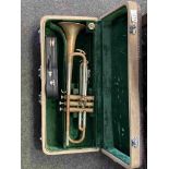 A Boosey & Hawkes brass trumpet (a/f) and a miniature decorative guitar,