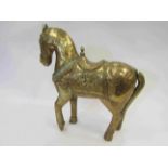 An Islamic style horse with brass covered rivetted detailing,