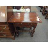 An early 18th Century style side table with single drawer and bobbin turned stretchers,